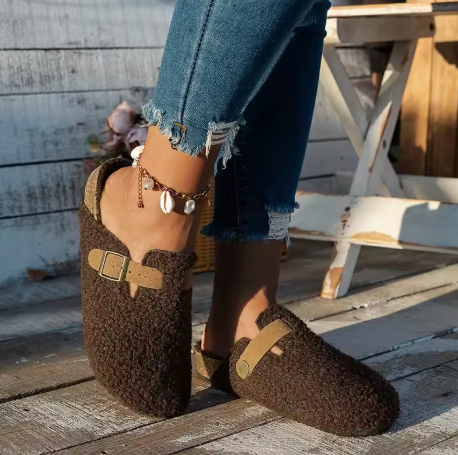 Hemingway sherpa lounge slippers in warm tones with plush lining, buckle accent, and supportive sole