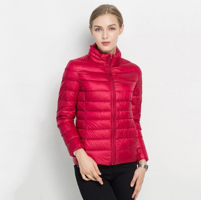 Women's slim-fit quilted jacket with zip front, high collar, insulated for transitional weather