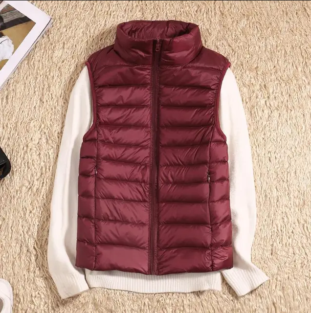 Women's ultralight packable down jacket in sleek lightweight design for cold weather sustainable insulation