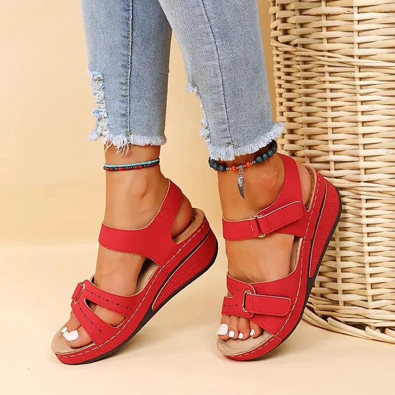 Beige platform sandals with adjustable velcro straps, cushioned sole, and contoured insole support