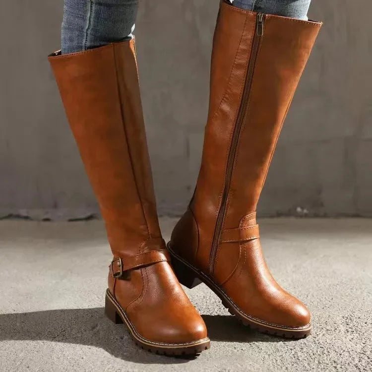Women's black knee-high boots with elegant buckle detail, all-day comfort and modern stylish support