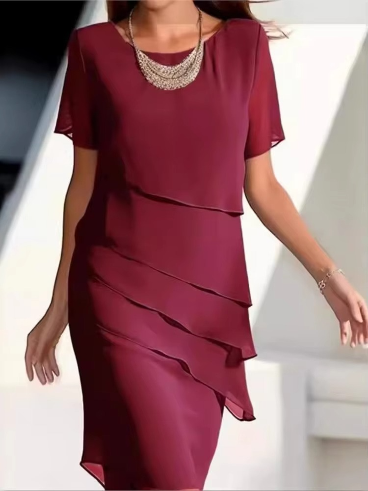 Women's lightweight casual summer dress with short sleeves, round neckline, and ruffle hem edge