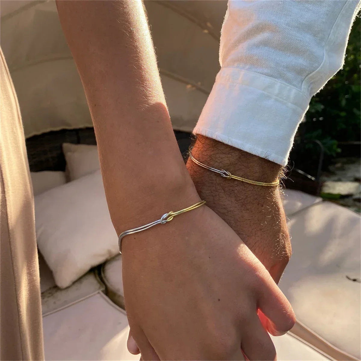 Gold-plated stainless steel link bracelet with delicate knot centerpiece, tarnish-resistant everyday elegance