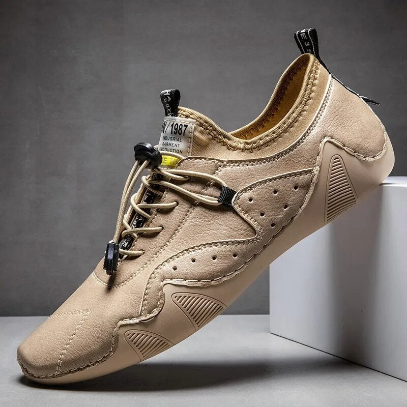 Men's tan perforated leather low-top driving shoes with bungee lace and orthopedic support
