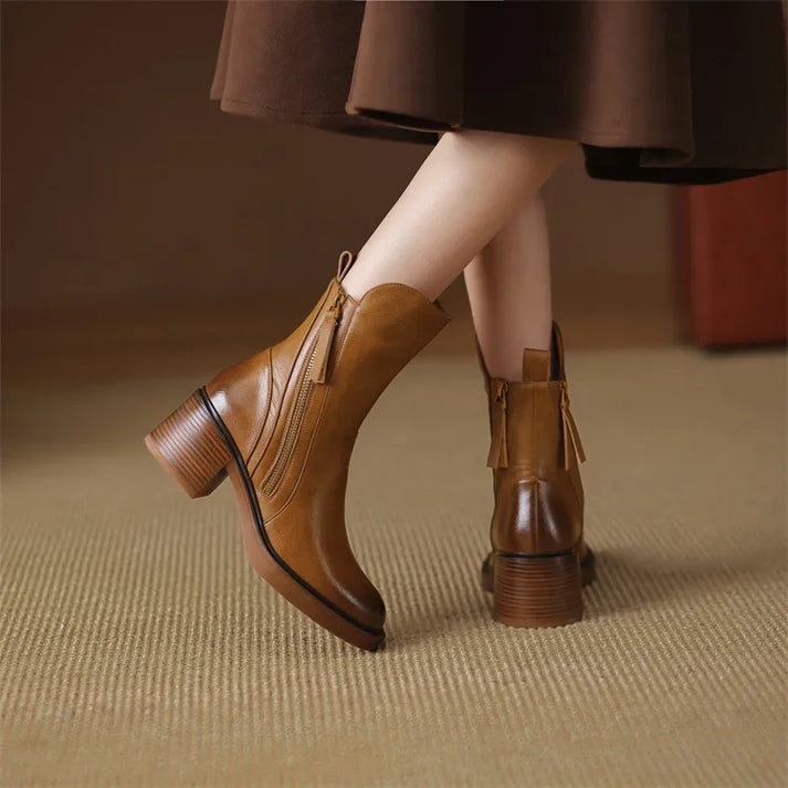 Women's black leather ankle boots with side zipper, sleek everyday style for effortless polished looks