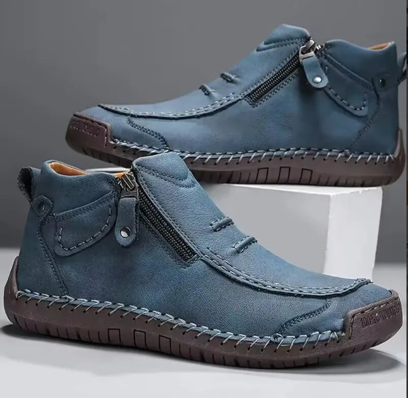 Men's brown premium leather Derrington boots with hand-stitched detailing, cushioned sole, and side zip