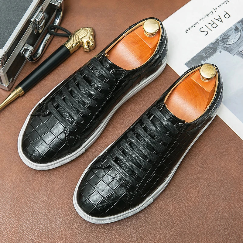 Men's white low-top leather sneaker with subtle alligator embossing and cushioned sole
