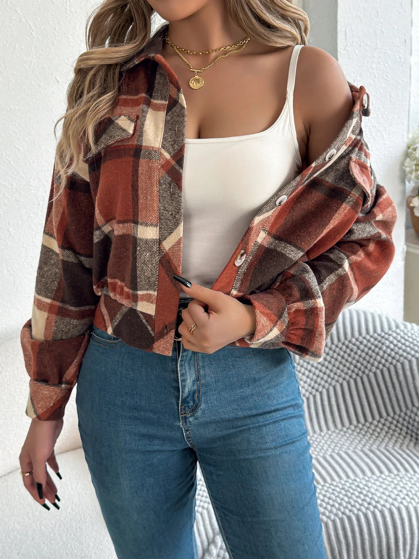 Women's cropped plaid jacket in warm tones, waist-length silhouette with bold pattern brushed cozy fabric