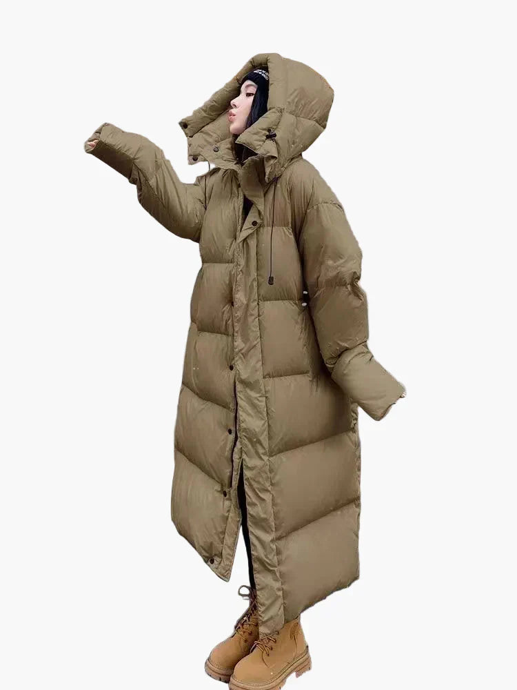 Women's long hooded quilted puffer coat in winter style with full-length padded coverage
