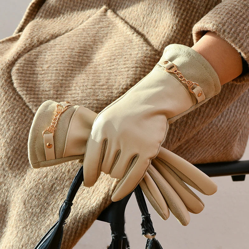 Women's black leather wrist-length fitted gloves with gold chain accent detail