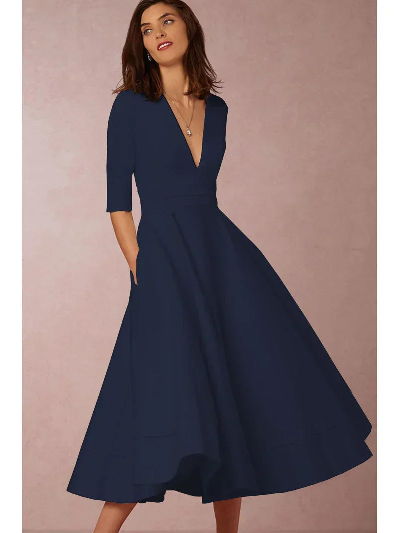 Elegant black A-line midi dress with deep V-neck, textured luxurious fabric, and three-quarter sleeves