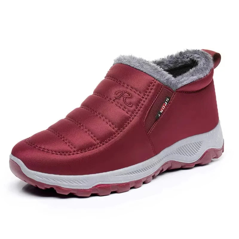 Women's quilted waterproof slip-on ankle boots with faux fur lining, sleek urban style for fall