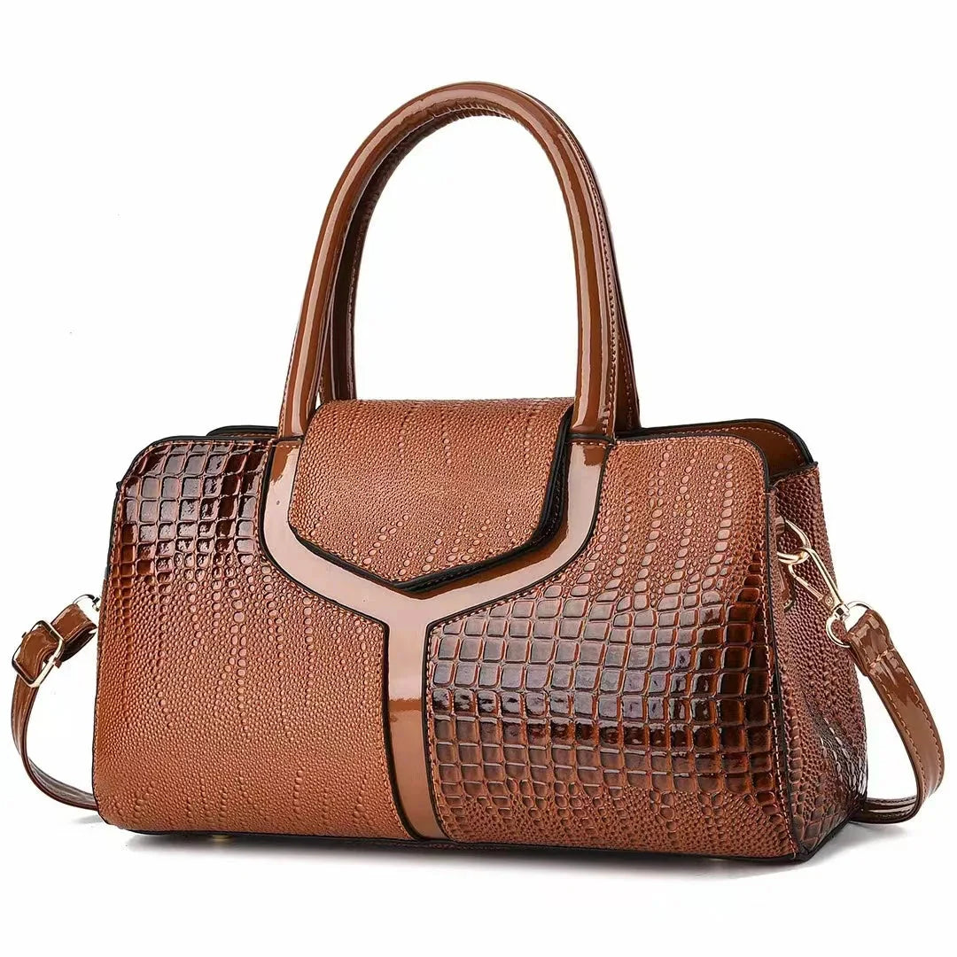 Women's structured brown embossed leather satchel bag with polished silhouette for everyday use