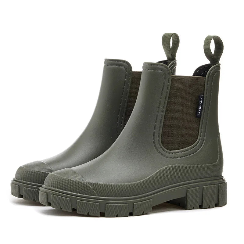 Women's black Chelsea rain boots with elastic side panels, 100% waterproof ankle-height silhouette