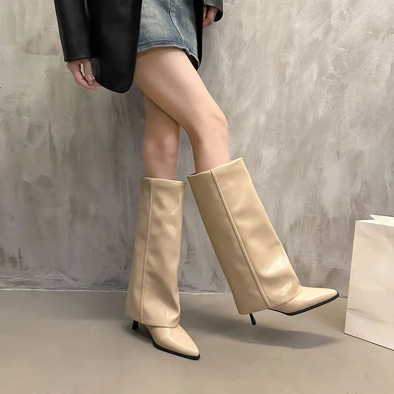 Women's black leather thigh-high boots sleek structured silhouette with refined buckle detail