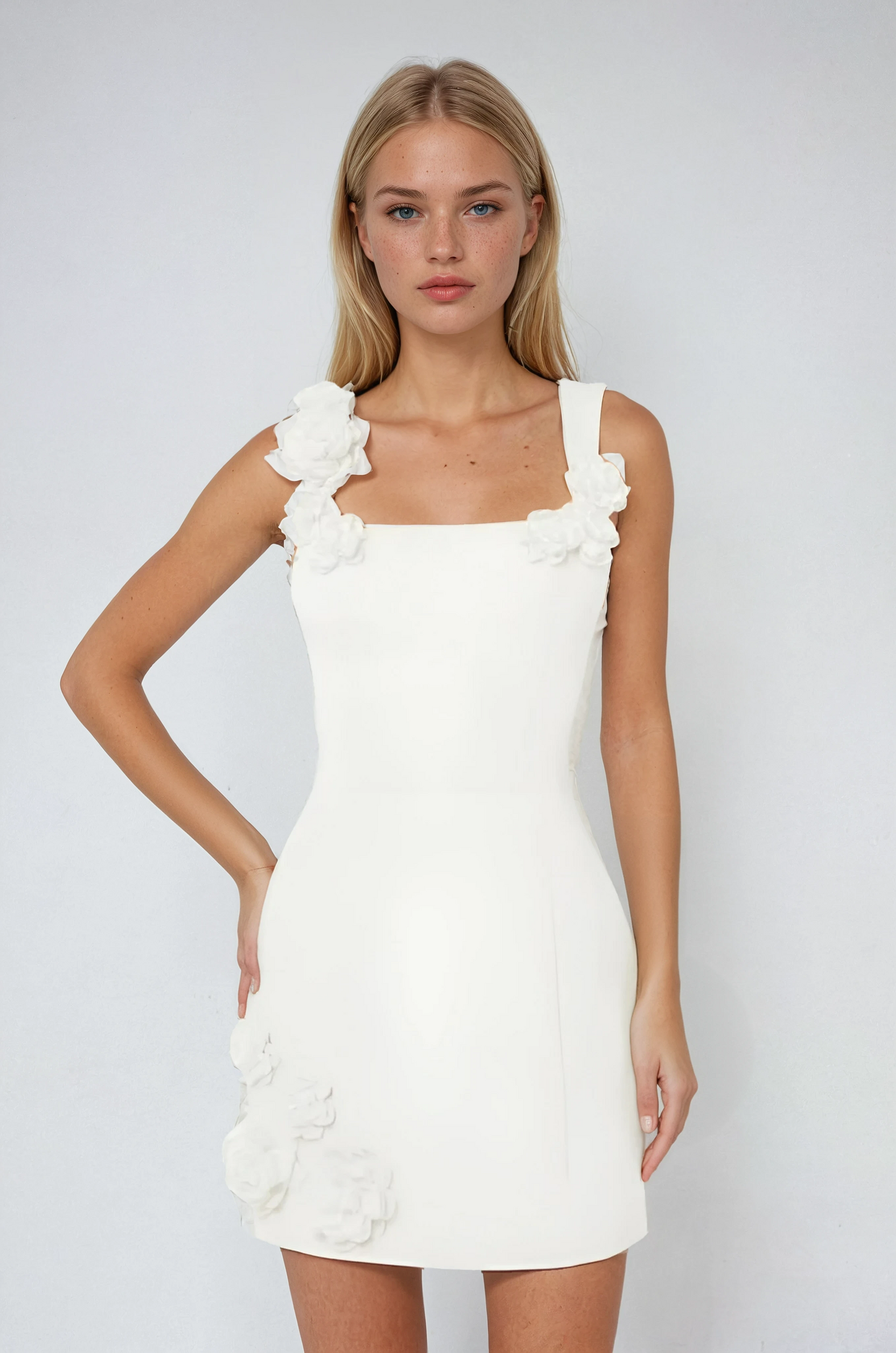 Pink mini dress with 3D floral appliqués, sculpting bodice, bold neckline and hem details for summer