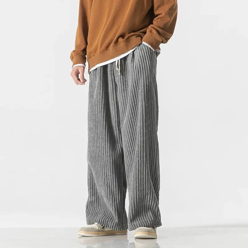 Men's wide leg ribbed sweatpants in neutral tone with adjustable drawstring waist for all-day comfort