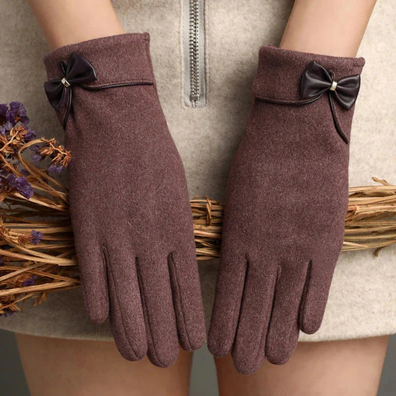 Women fitted wool wrist-length gloves in classic tones with feminine bow detail accent