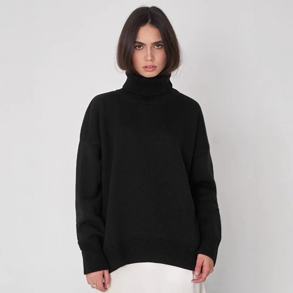 Women's oversized cream ribbed turtleneck sweater with soft knit blend and relaxed silhouette