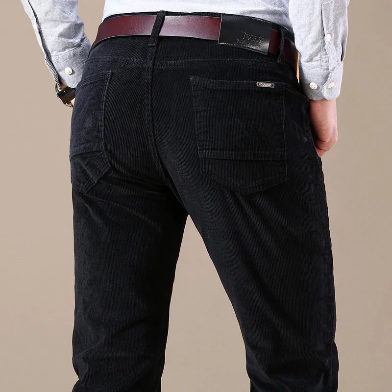 Men's slim-fit elastic corduroy pants in neutral tone with stretch waistband for versatile wear