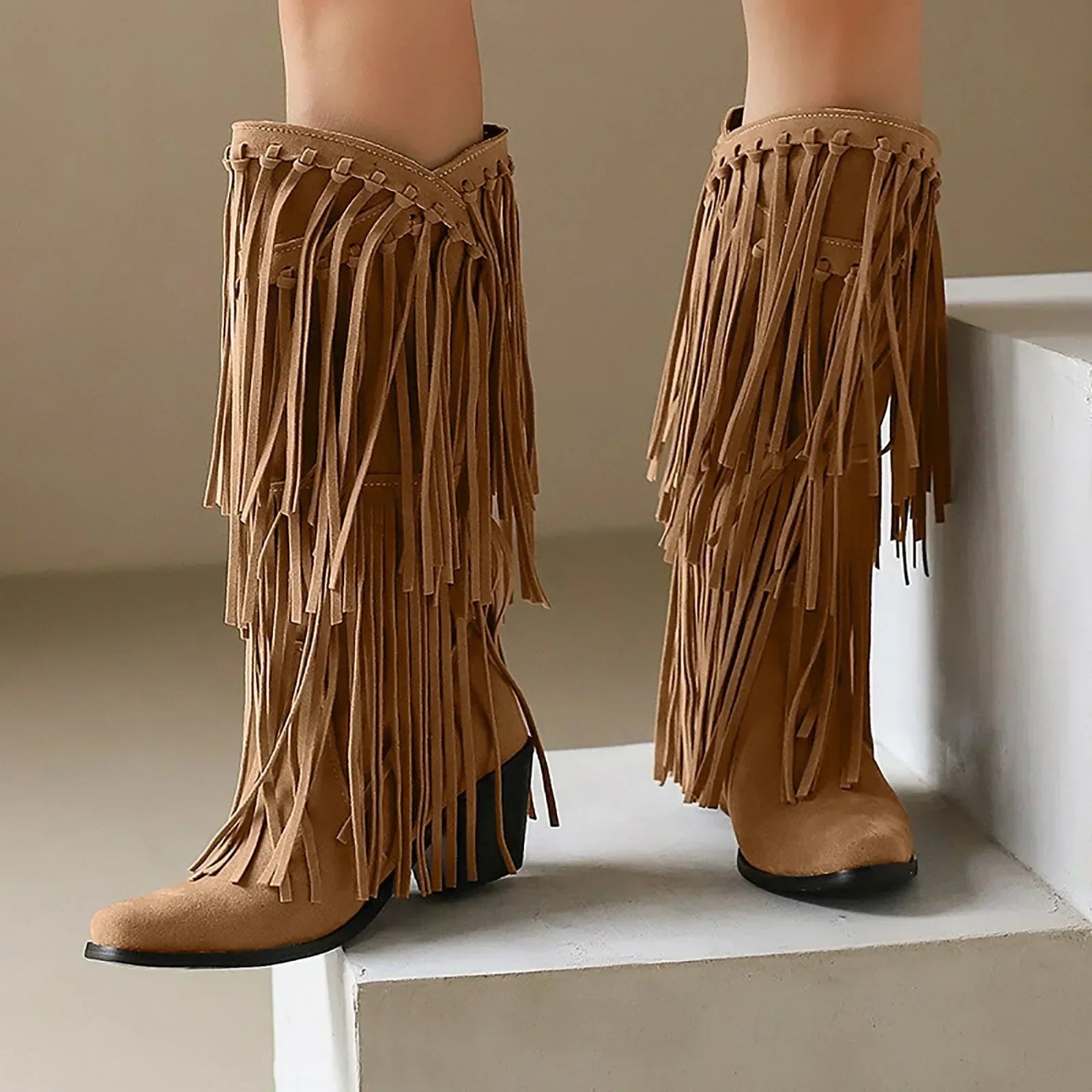 Women's western knee-high boots with flowing fringe detailing and sturdy block heel in bold style