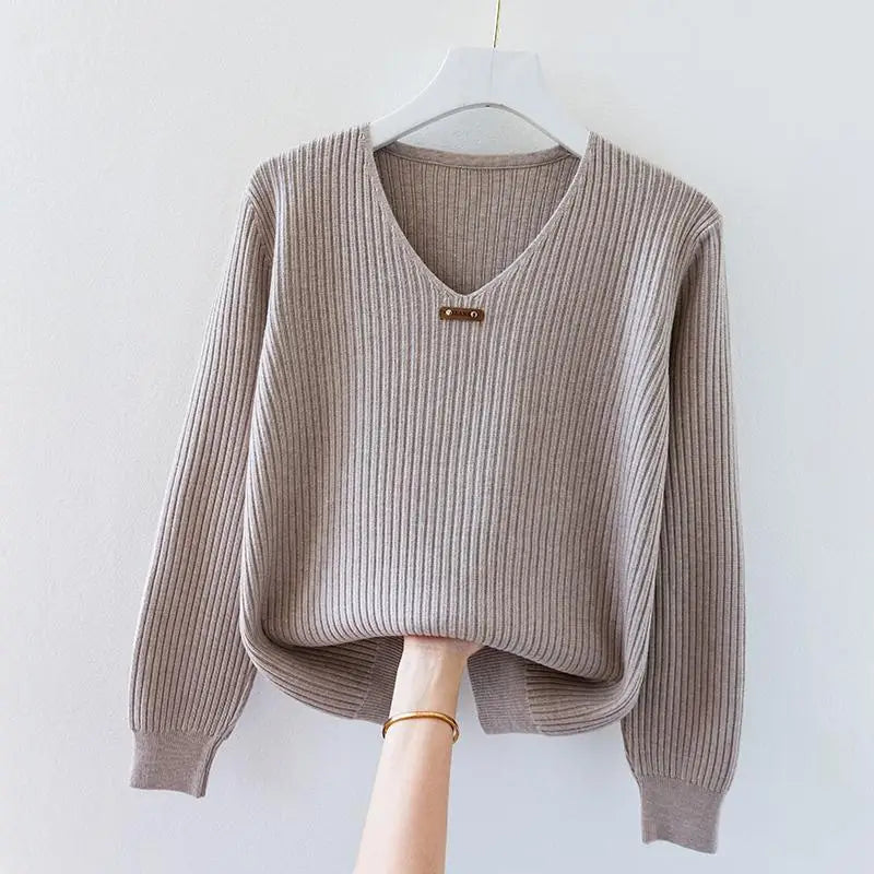 Women's ribbed knit V-neck top in lightweight stretch fabric with draped slim fit and minimalist collar charm