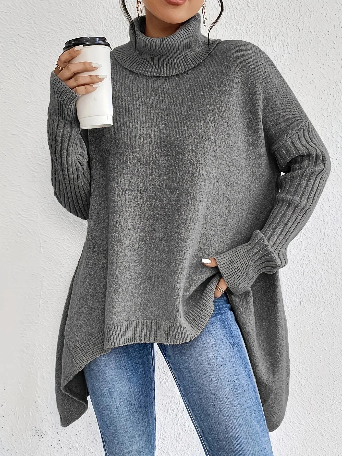 Women's relaxed fit turtleneck sweater with asymmetrical hem, cozy wool texture, chic everyday style