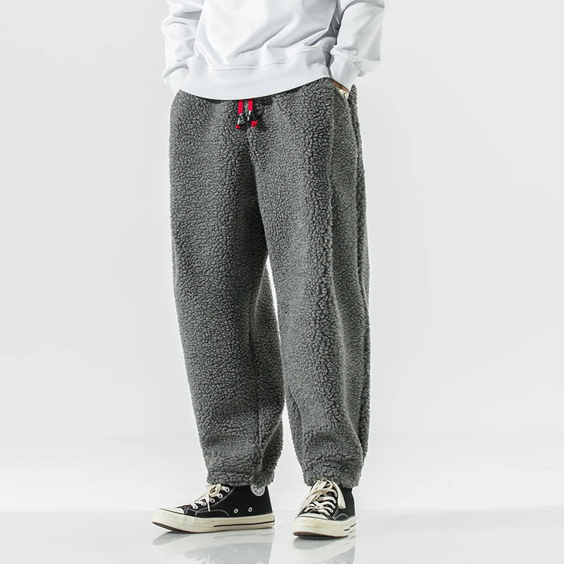 Men's relaxed fit fleece sweatpants with drawstring waist, deep pockets, cozy comfort style