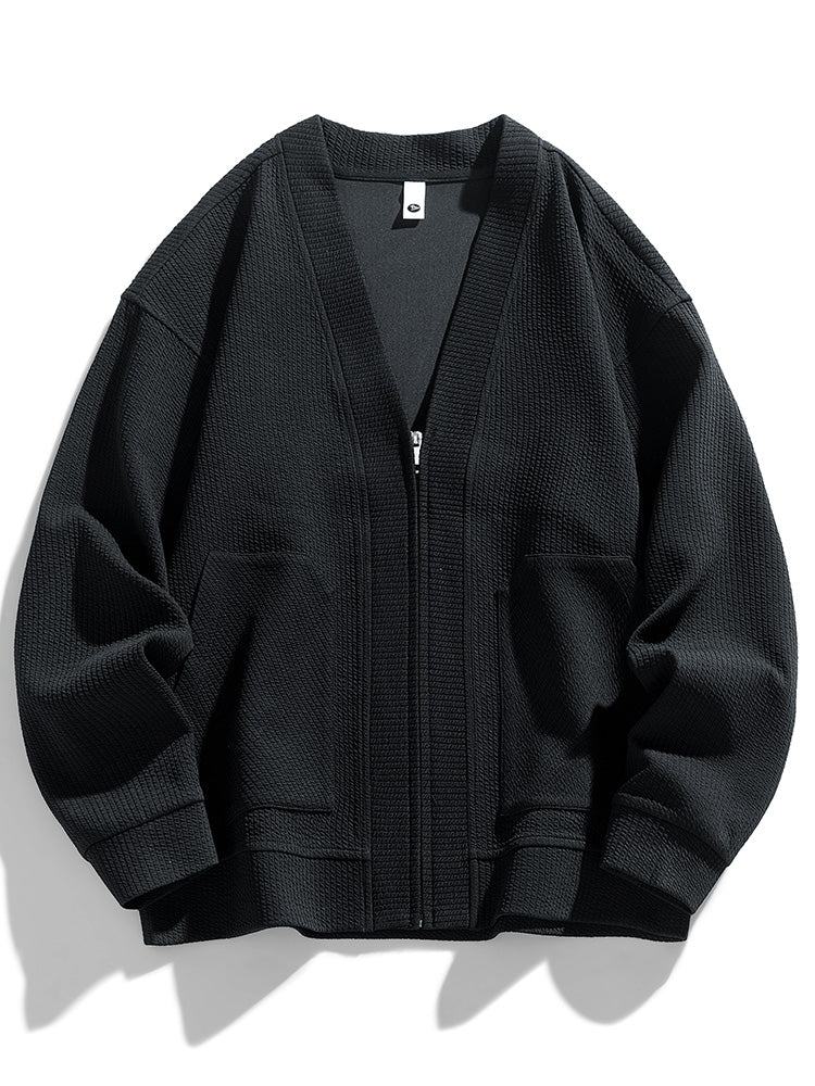 Oversized zipped cardigan textured cotton blend relaxed fit neutral tones sleek zip closure