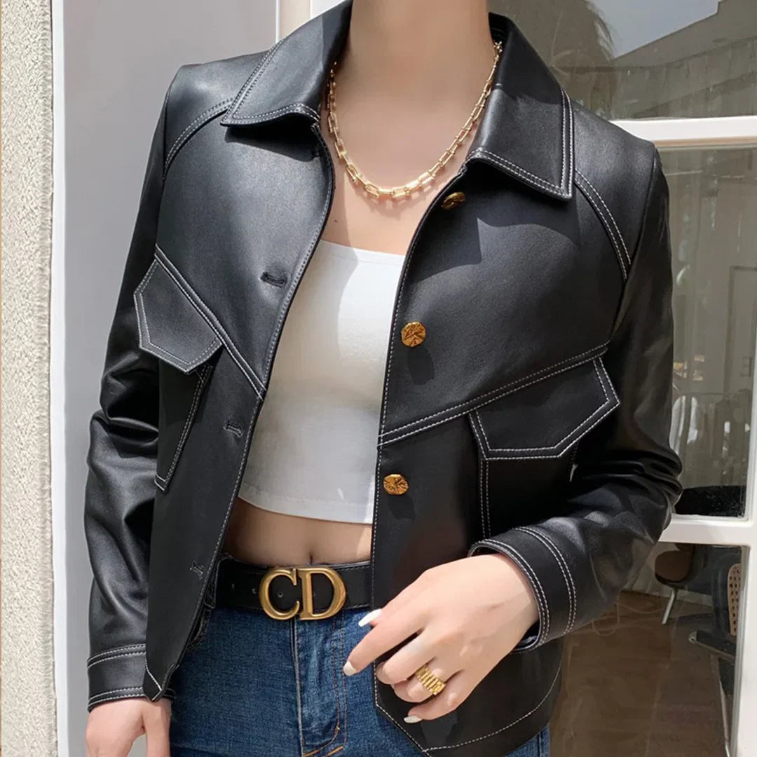 Men's slim fit vegan leather moto jacket with lapel collar, contrast stitching, and vintage cropped silhouette