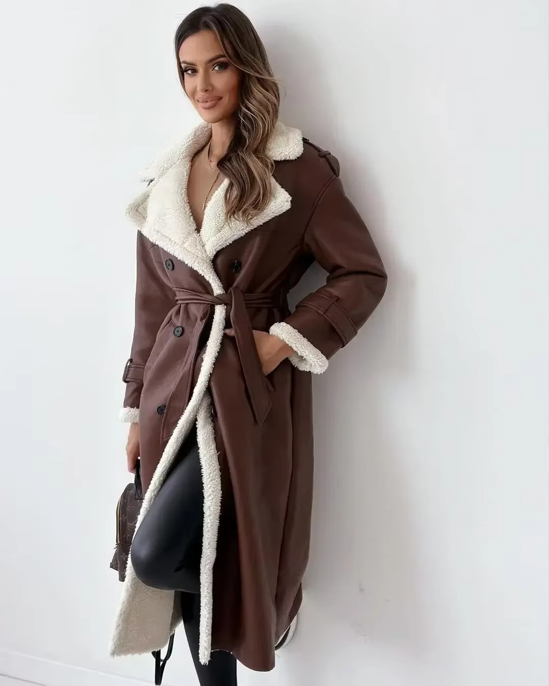 Women's black PU leather double-breasted trench coat with stand collar and plush interior lining