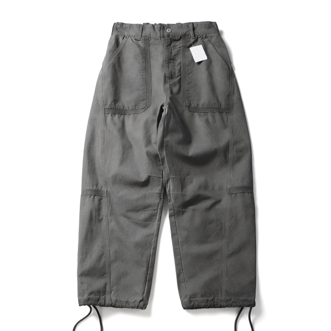 Khaki wide-leg cargo trekking pants with elastic waist, adjustable hem, and oversized multi-pocket design