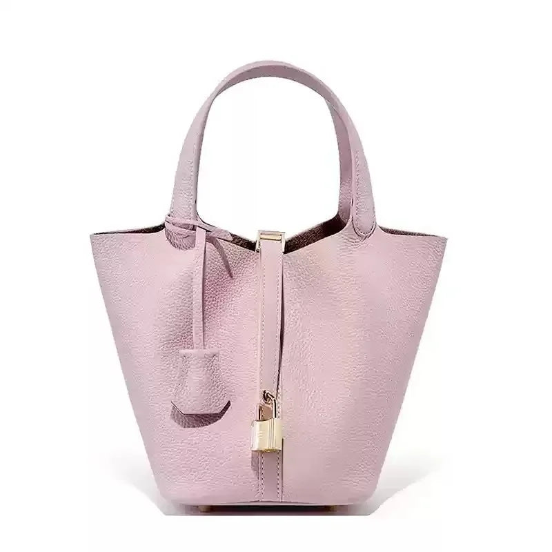 Structured grain leather tote bag for women, timeless silhouette with secure strap closure, all-season carry