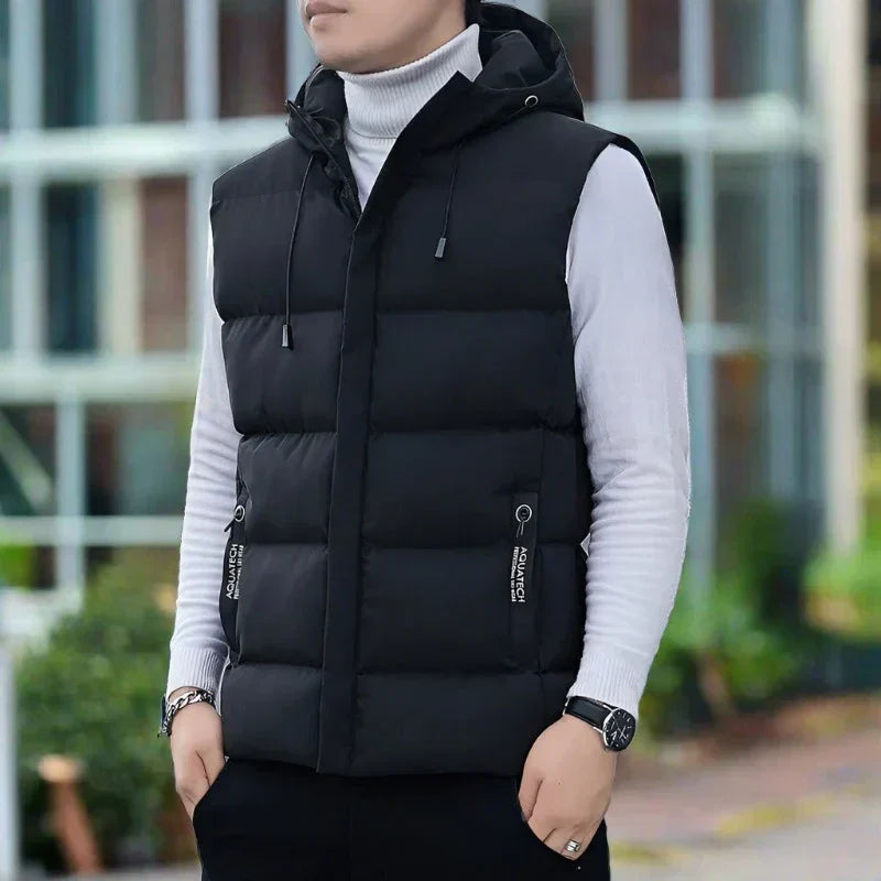 Men's slim fit quilted vest with hood, zipper pockets, lightweight insulated layer for modern style