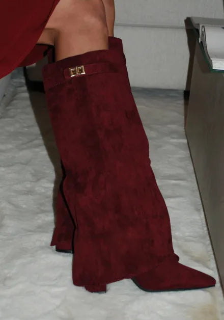 Black leather thigh-high boots with buckle detail, sleek fitted silhouette for elegant city style