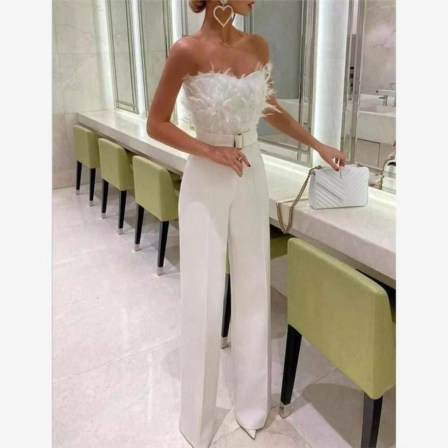 Black feather-trim wide-leg jumpsuit bare shoulder cinched waist diamond embellished party look
