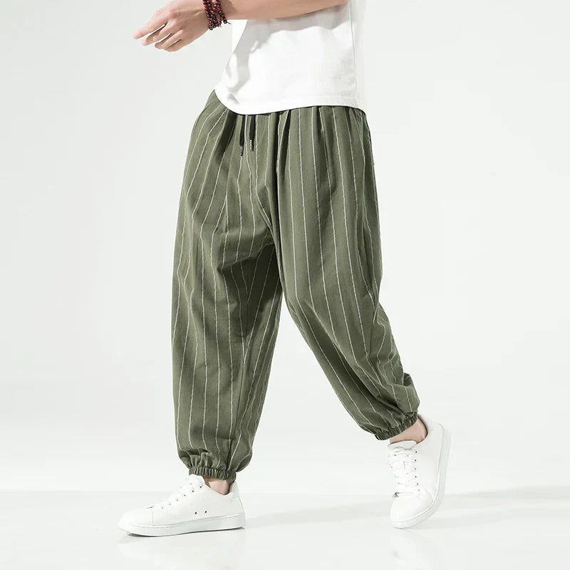 Men's relaxed fit white pinstripe cotton trousers with elastic waistband and classic stripe detailing
