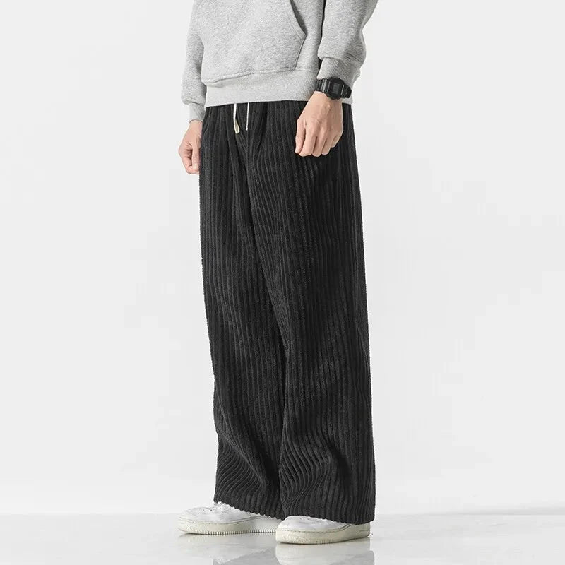 Men's wide leg ribbed sweatpants in neutral tone with adjustable drawstring waist and relaxed fit