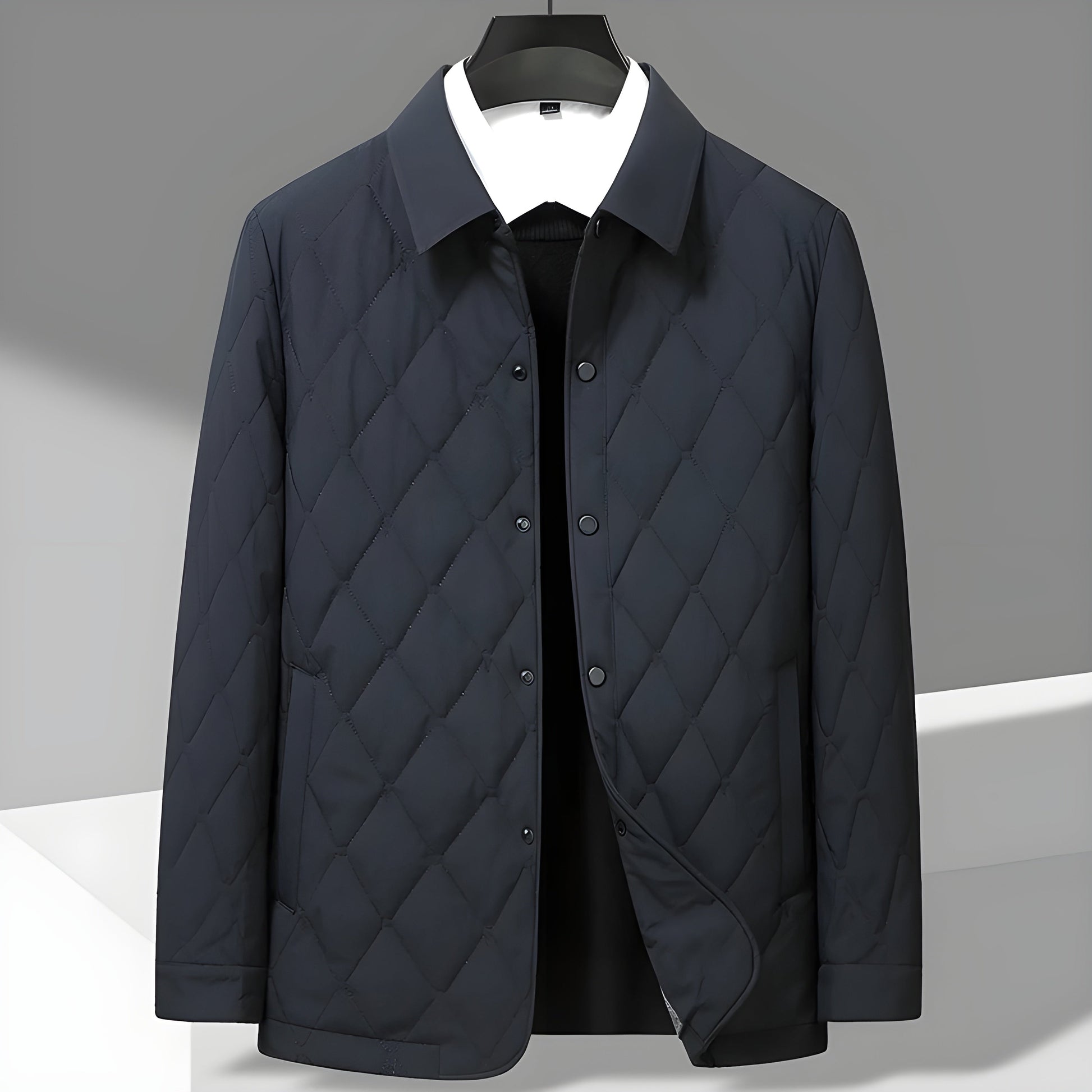 Men's navy diamond quilted jacket with silky structured exterior and breathable cotton lining