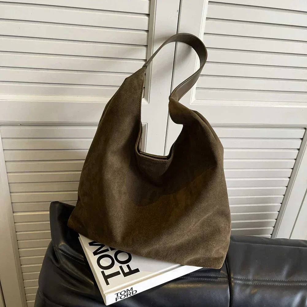 Minimalist women's tote shoulder bag in neutral tone with spacious interior and clean silhouette
