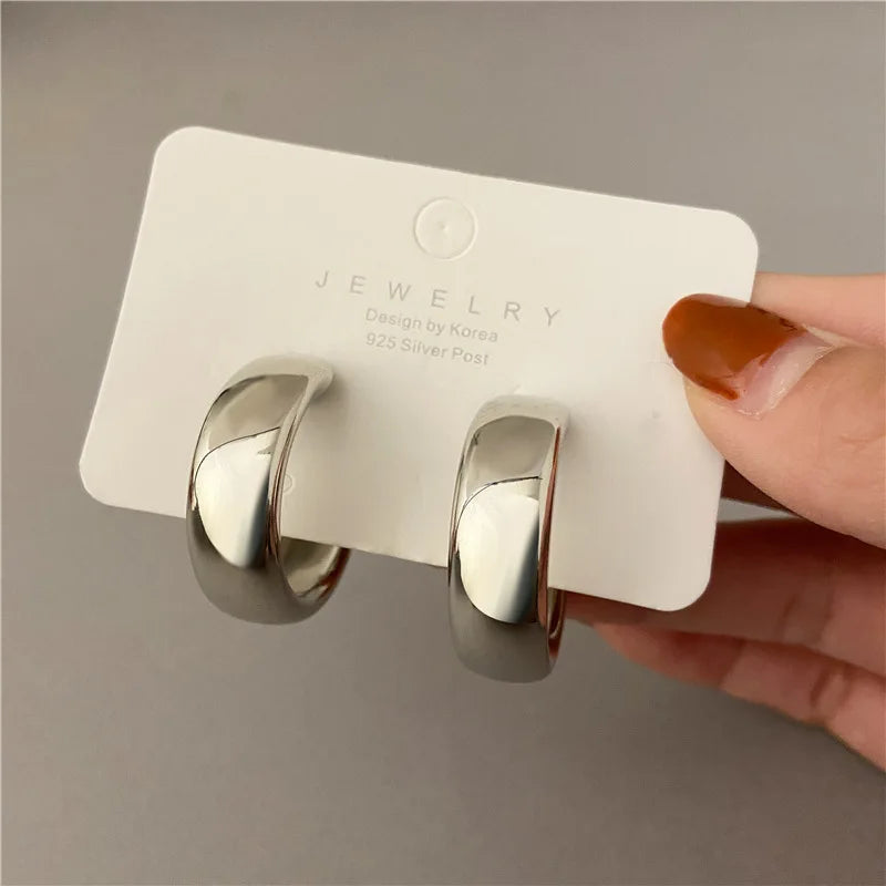 Chunky polished silver hoop earrings bold oversized silhouette non-tarnish everyday statement jewelry