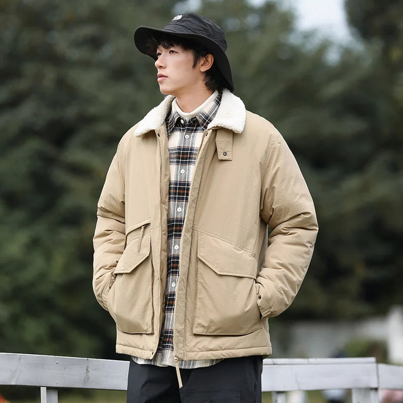 Oversized boxy puffer jacket with white sherpa collar in muted tones, unisex urban cold-weather style