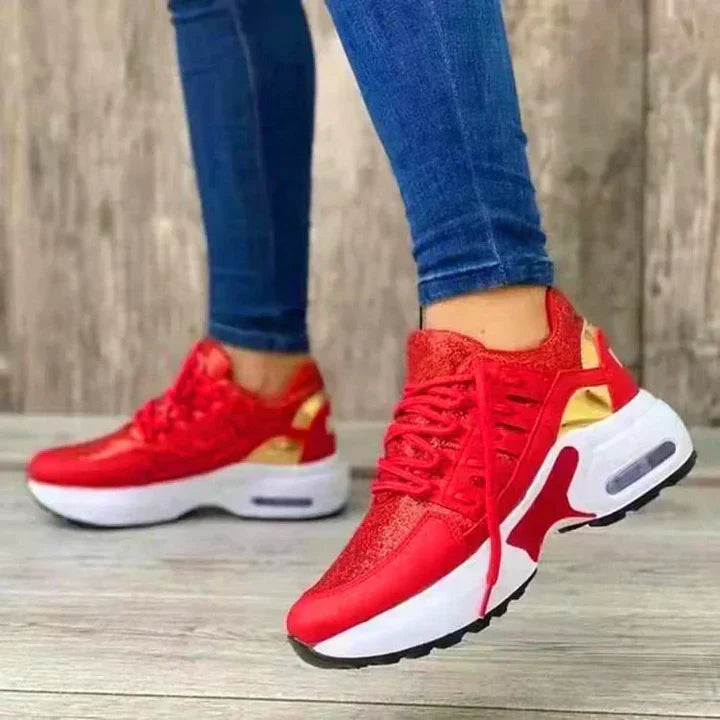 White orthopedic running shoes with ergonomic cushioned sole and shock-absorbing support for stable comfort