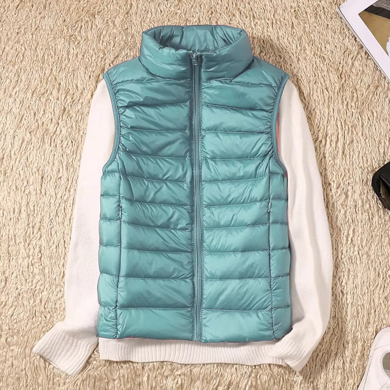 Women's cropped sleeveless down puffer vest lightweight nylon shell for layering and outdoor warmth