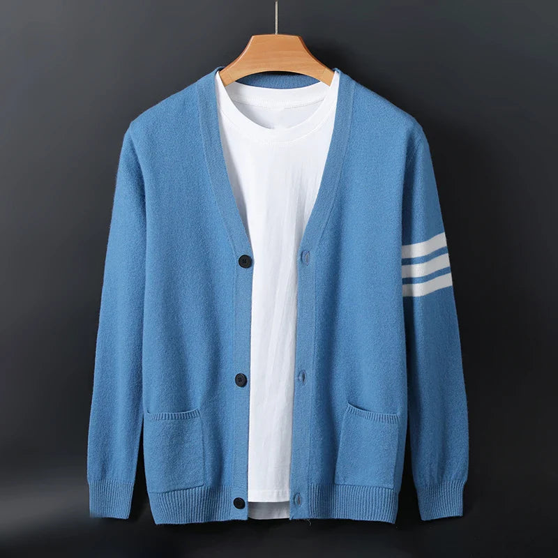 Women's knit cardigan with striped sleeves, button front, pockets, and ribbed trim in casual style
