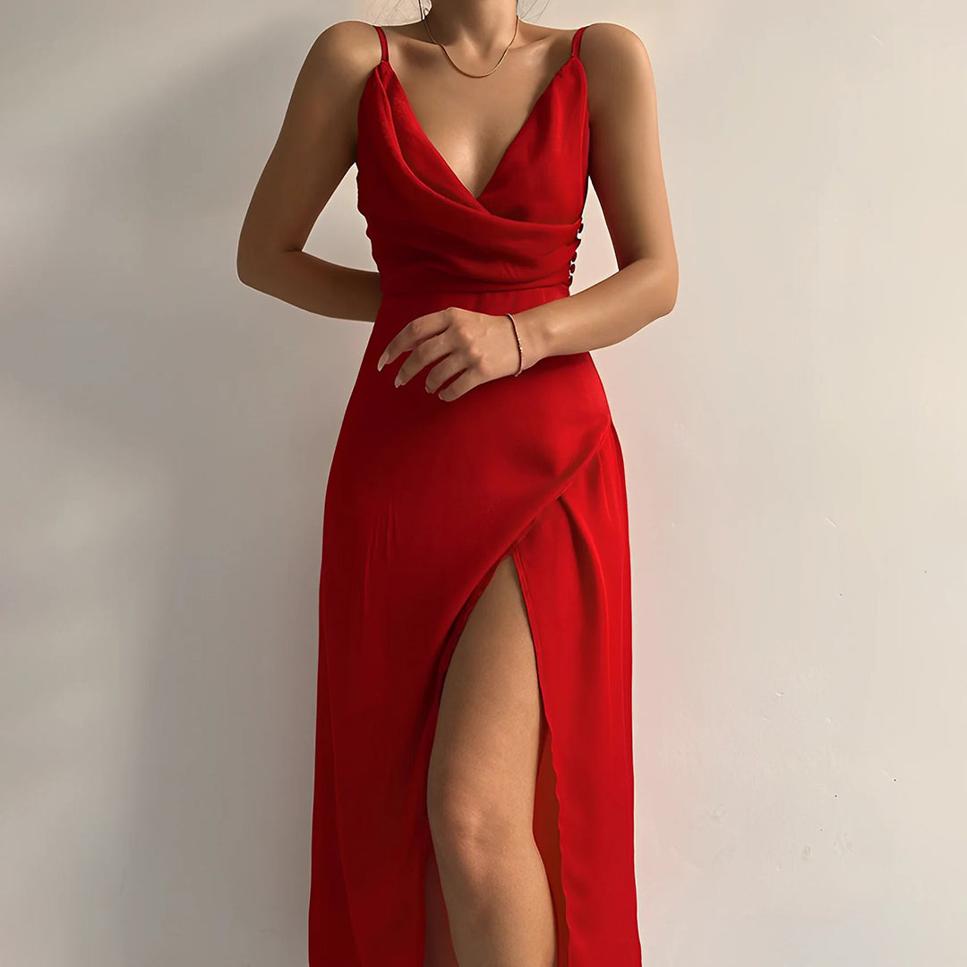 Black luxury formal maxi dress with draped neckline, thigh-high slit, and wrap-inspired bodice for elegant evenings
