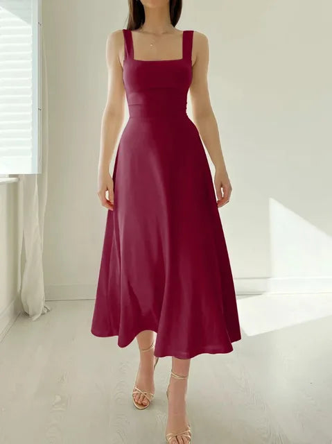 Women's elegant A-line dress with fitted waist, flattering neckline, timeless polished silhouette