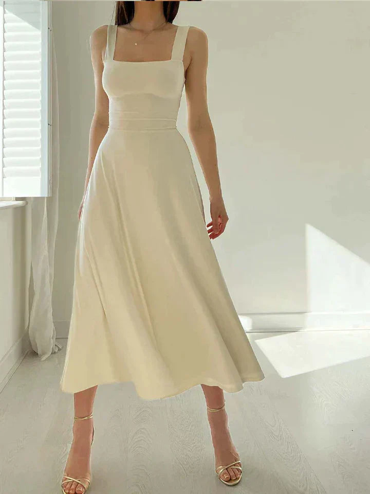 Women's elegant A-line dress with fitted waist, flattering neckline, timeless polished silhouette
