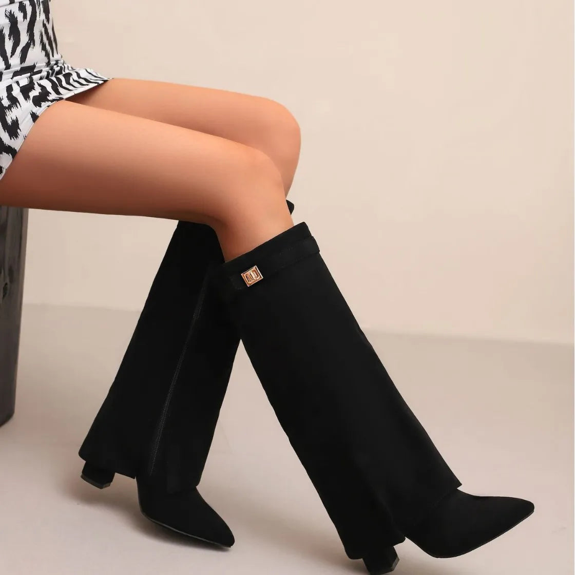 Women's black leather thigh-high boots with bold buckle detail for elegant city style