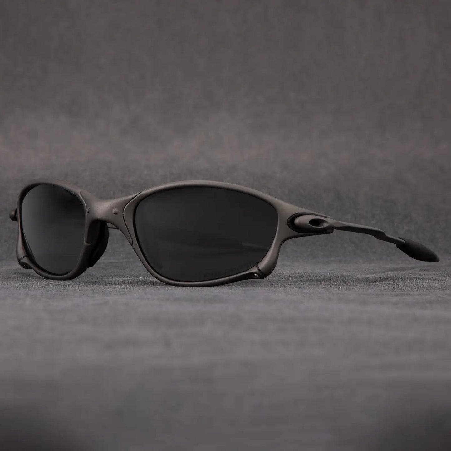 Matte black polarized sunglasses with UV400 glare-blocking lenses, sleek wraparound fit for outdoor sports